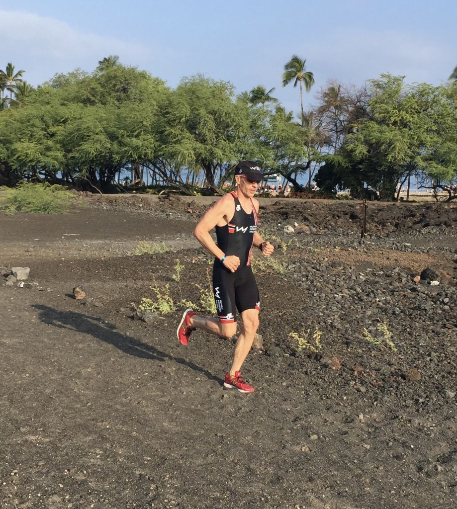 Mike running through lava field in Waikoloa Hawaii with Human Powered Racing race kit on.