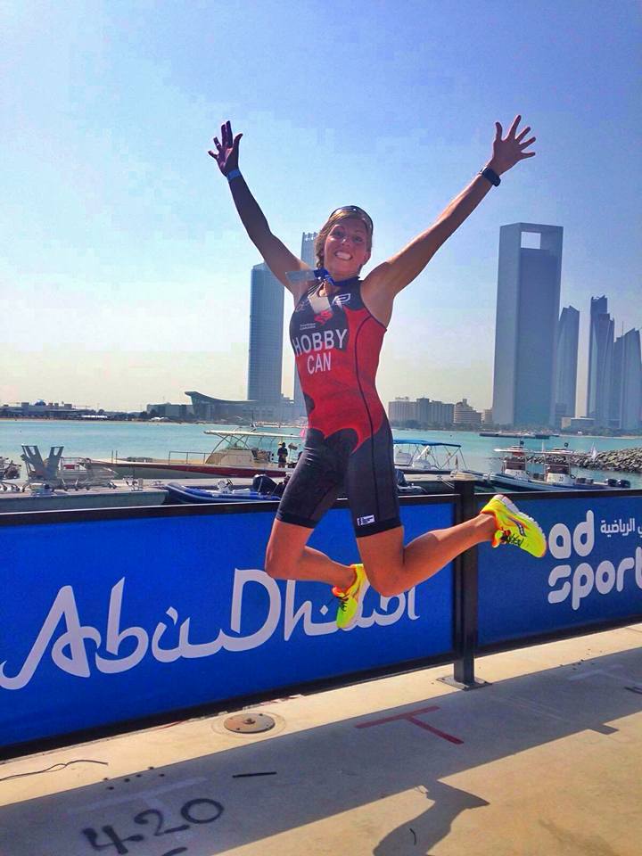 Kara Hobby jumping for joy at the Abu Dhabi ITU Triathlon Sprint race after finishing 15th overall