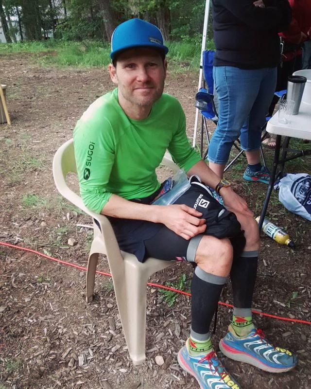 Adrian Walton sitting down in a chair after his first 100km ultra marathon