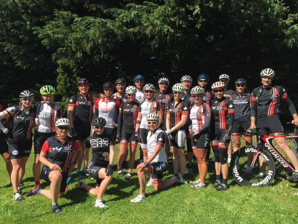 Human Powered Racing athletes gathered for a picture in their HPR kits on a 2016 summer ride near Metchosin