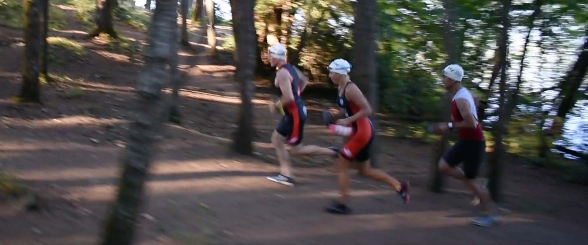 Runners charge up a hill while training for the Swimrun at Thetis Lake.