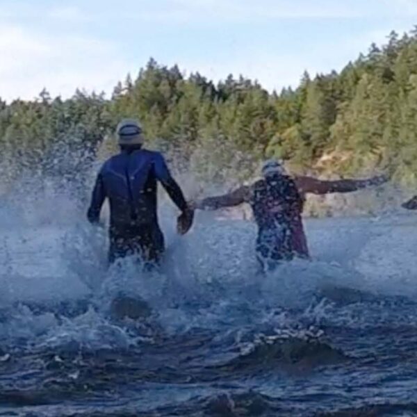Racers charge into the water at Thetis Lake.