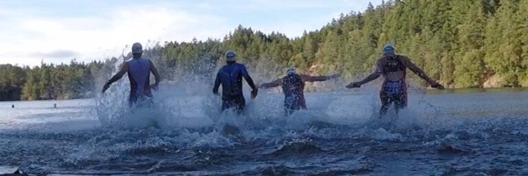 Racers charge into the water at Thetis Lake.