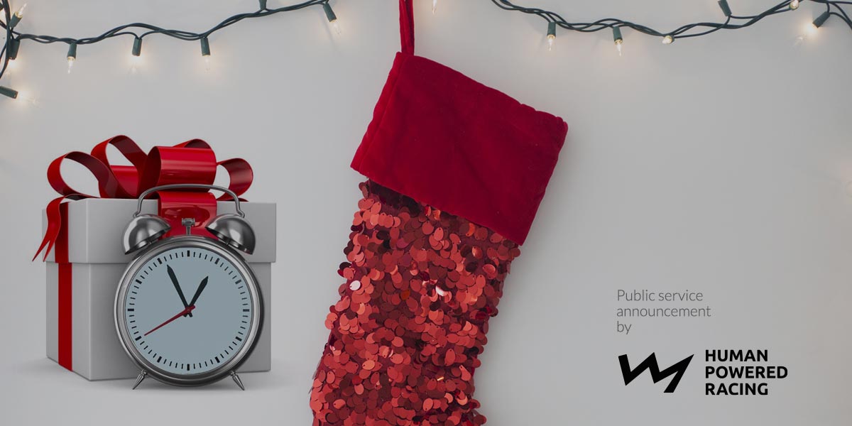 A gift of time sits beside a stocking: Happy holidays!