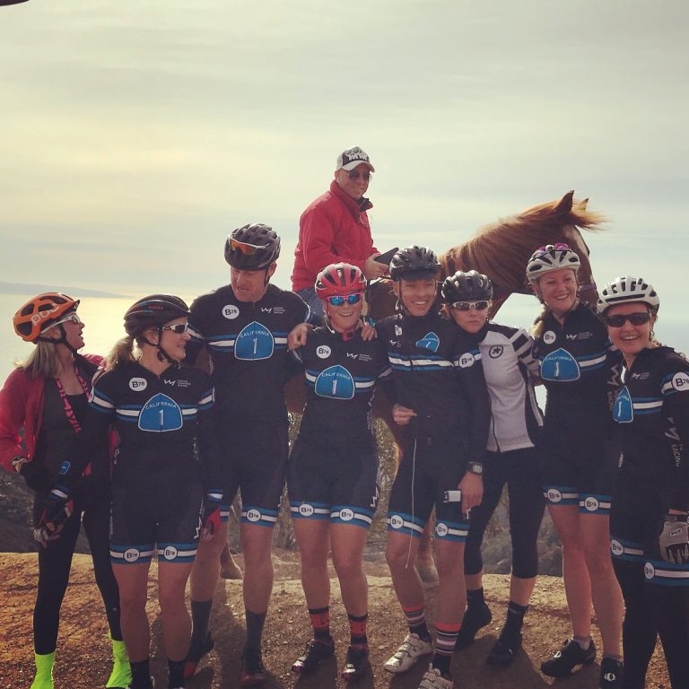 Photo at Vertical Bike Camp at top of Piuma Climb with athletes and horse