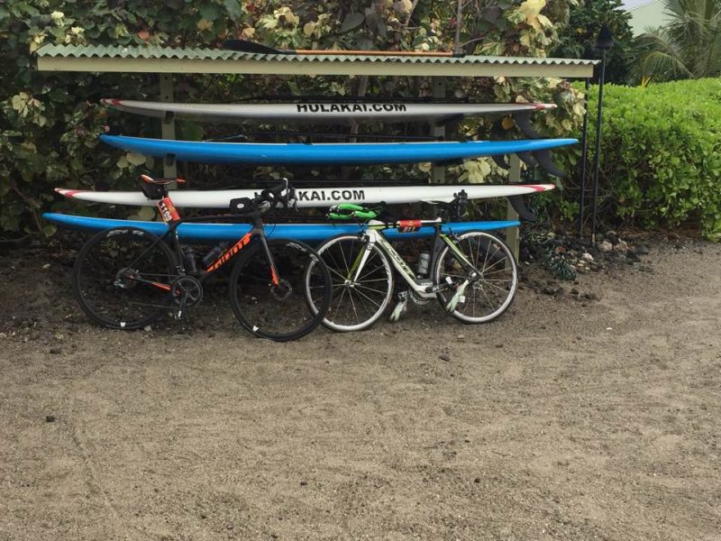 Daphne and Ed's bikes leaning up against surf boards in Hawaii 