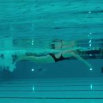 Swimmer does laps in the pool.