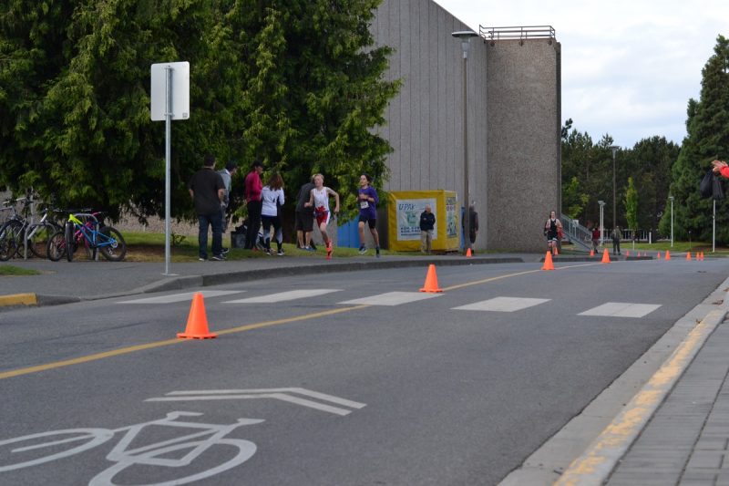 Racers coming into the transition zone at the UVic youth triathlon.