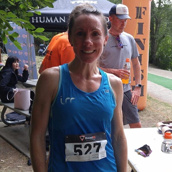 Racer smiles widely at the end of a great race.
