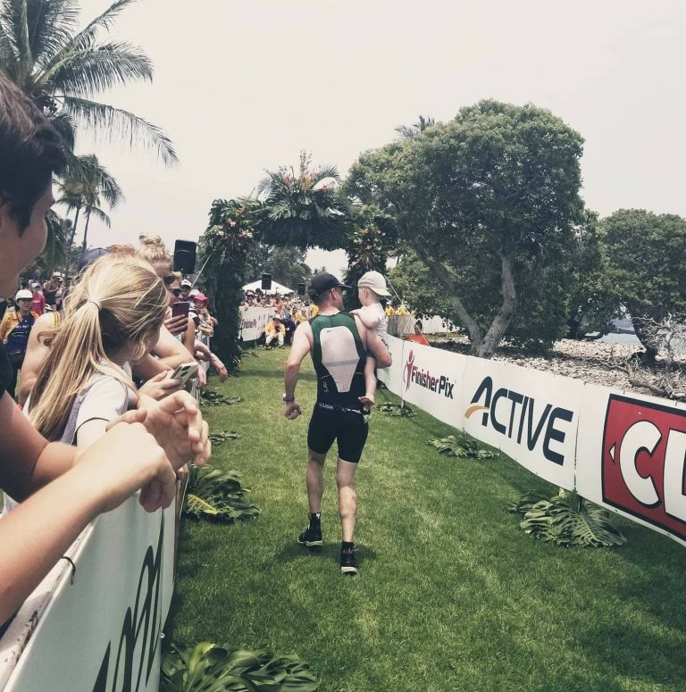 Richard and Lachlan crossing the finish like at Hawaii 70.3