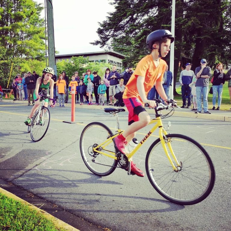 Kid on the bike racing at the HPR Youth Triathlon West Shore