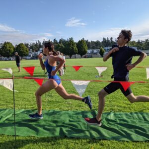 boy and girl running fast in a finishing shute