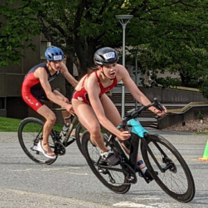 Victoria Youth Triathlon racers bank into the final stretch of the bike at UVic.