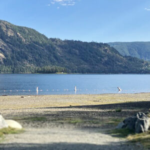 Beach, lake, and mountains.