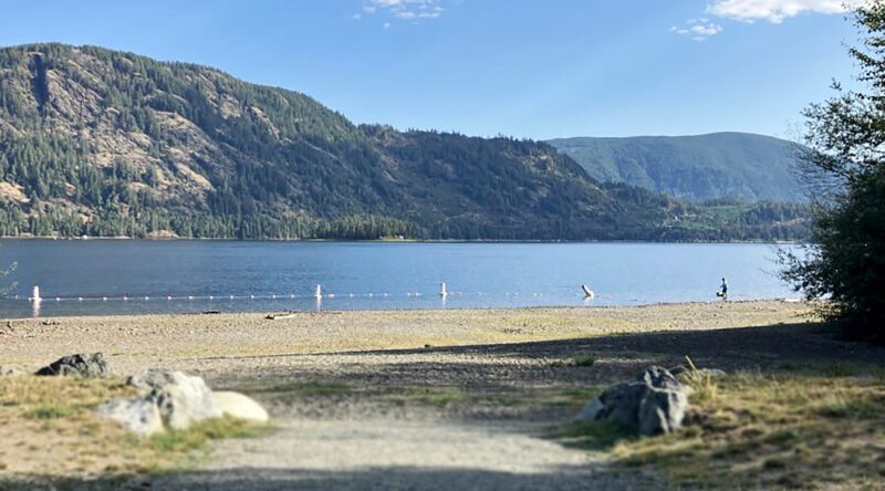 Beach, lake, and mountains.