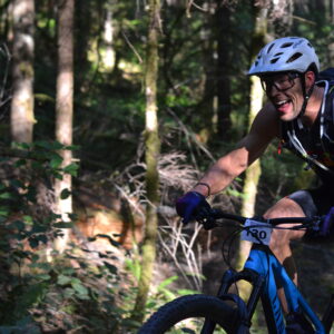 Male mountain biker riding in the forest
