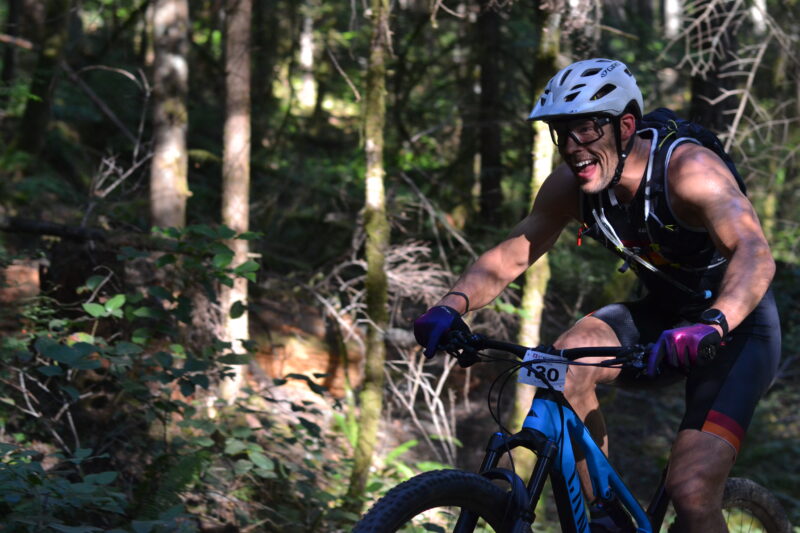 Male mountain biker riding in the forest