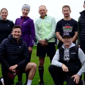 Rob and nine coaching students posing in a park