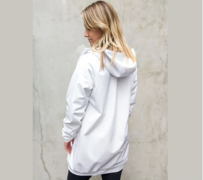 A blonde woman wearing a white swim parka