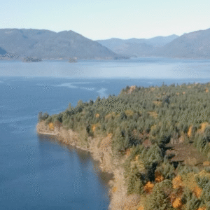 Aerial view of Cowichan Lake and the mountains around it.