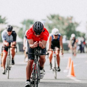 Dynamic shot of cyclists competing in an urban triathlon, showcasing endurance and speed.